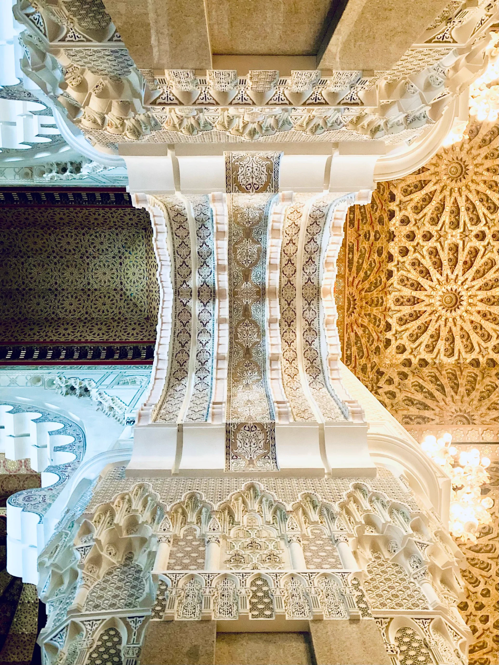 Intricate ceiling architecture inside Hassan II Mosque