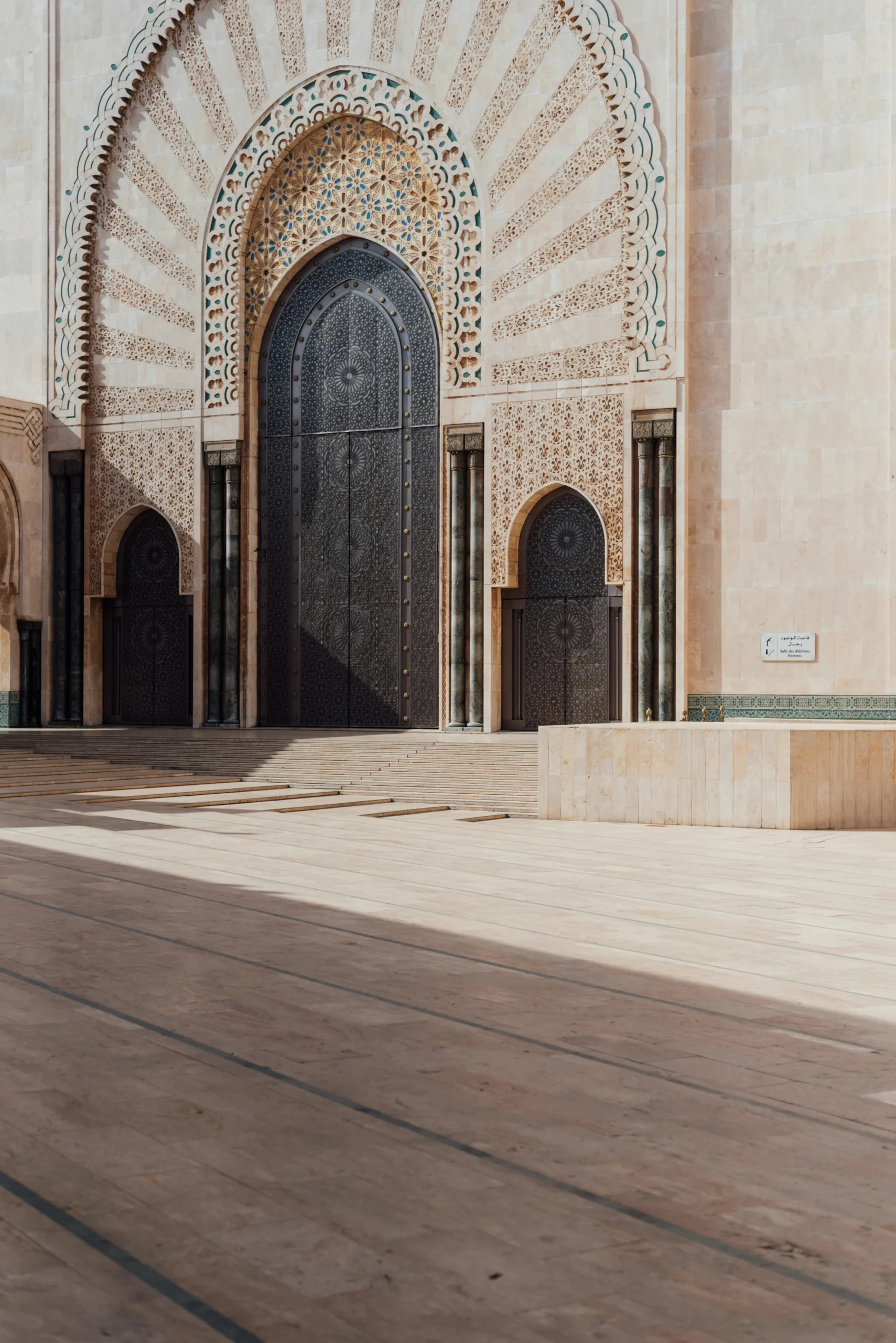 Hassan II Mosque viewed through an ornate archway